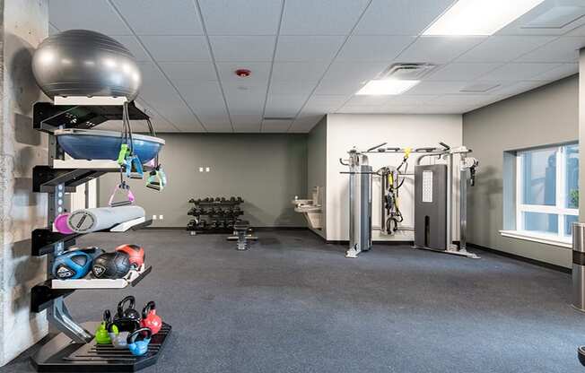 a large fitness room with weights and other exercise equipment at QUINN BY VINTAGE, Washington