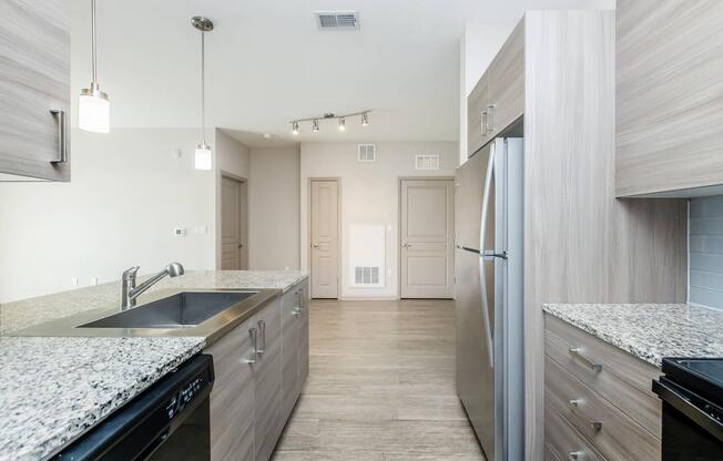 a kitchen with wooden cabinets