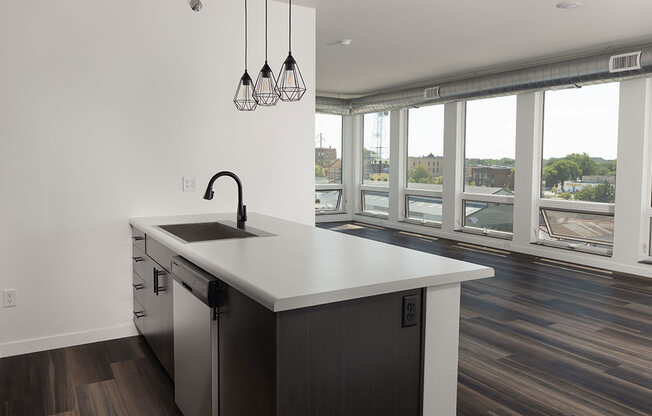 a kitchen with a large window and a sink at The Landing at 1001 NP, Fargo, ND 58102
