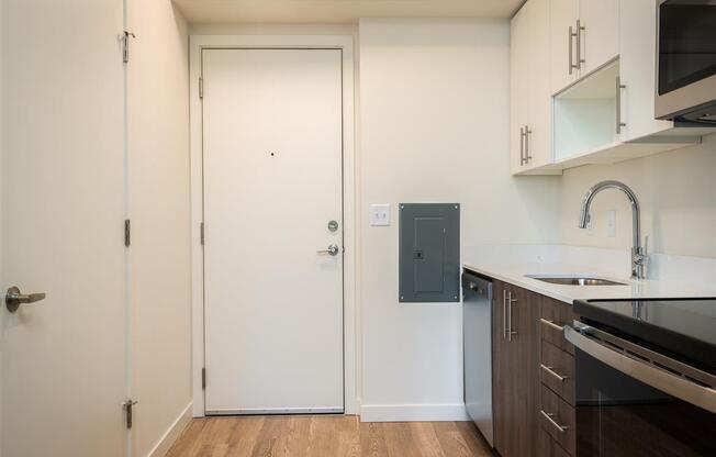 a kitchen with a sink and a door