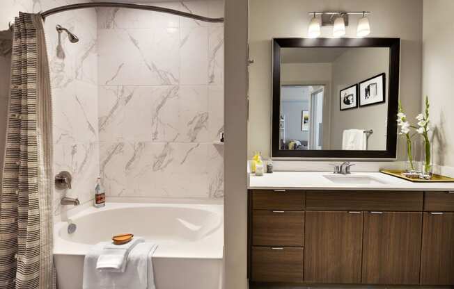 a bathroom with a bathtub and a sink