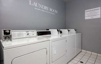 a laundry room with a washer and dryer