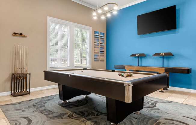 a game room with a pool table and a tv at Villages of Cypress Creek, Houston, Texas