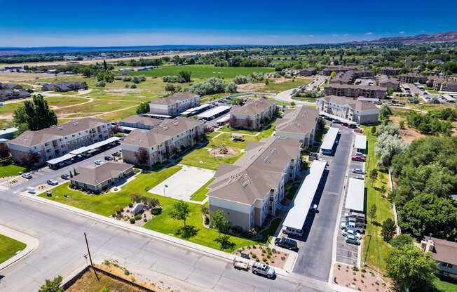 A large, well-maintained apartment complex with multiple buildings and green spaces.