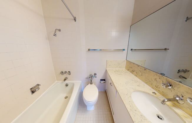 a bathroom with a bathtub and a sink