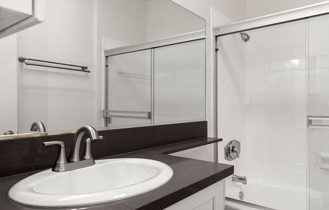 Modern styled bathroom with shower and tub.