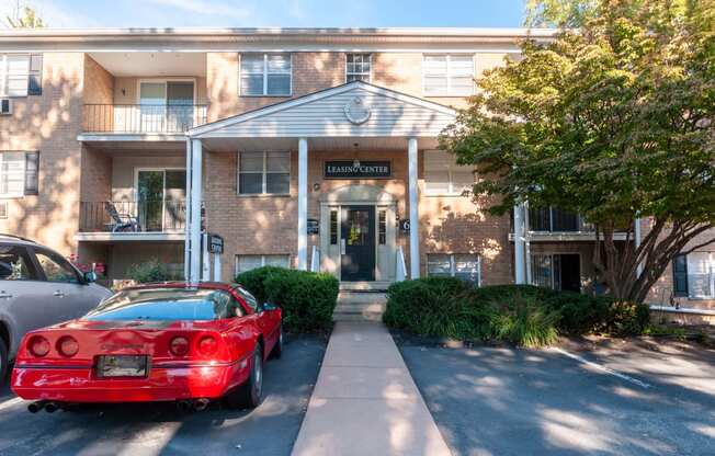 a red sports car parked in front of a building