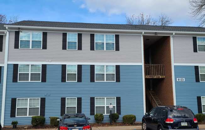 Outside view of building and parking at Brittany Place Apartments in Norfolk VA