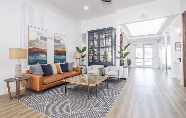 a living room with a leather couch and a coffee table