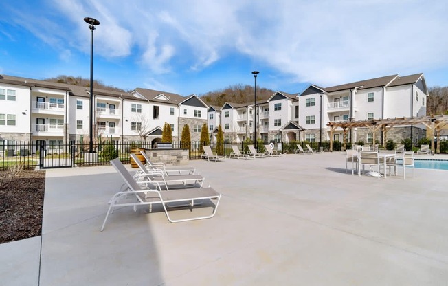 Ashland Farms Expansive Swimming Pool Area with Sundeck and Shaded Table Seating