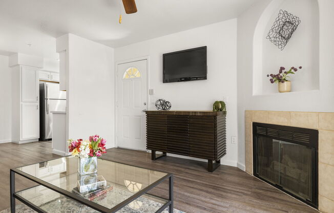 a living room filled with furniture and a fireplace