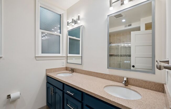 Bright pet friendly 3BR 2BTH with modern kitchen, wood flrs and laundry in unit!
