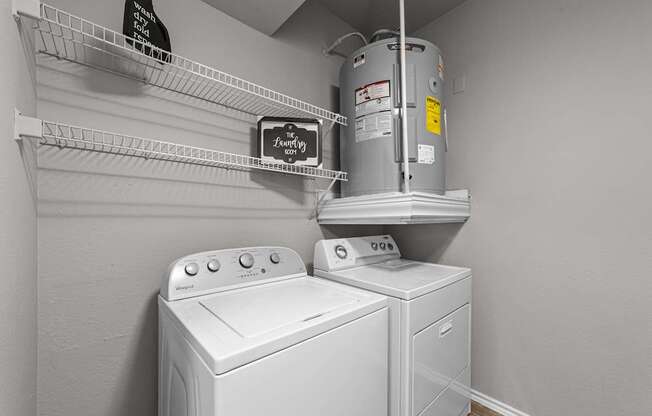 A laundry room with a washer and dryer.