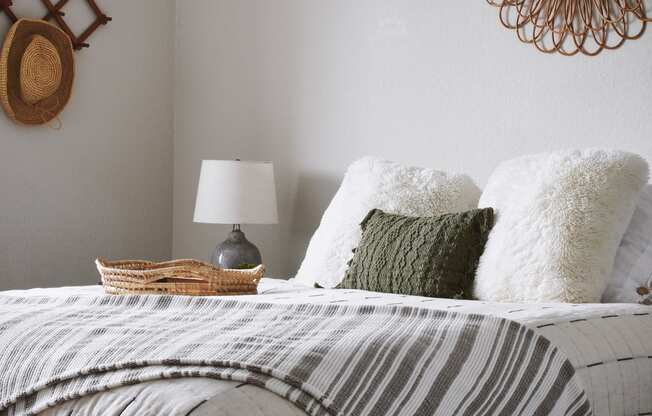 a bedroom with a bed and pillows