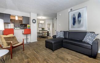 a living room filled with furniture and a flat screen tv