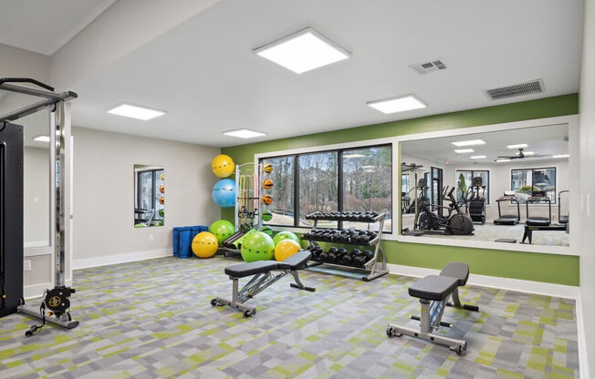 Community Fitness Center with Equipment and Mirrors at Element 41 Apartments in Marietta, GA.