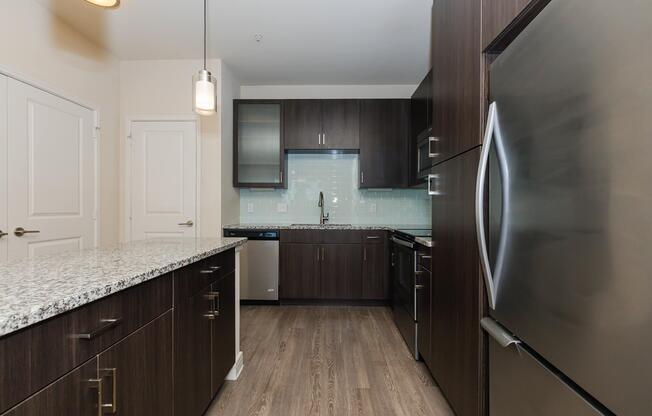 a large kitchen with stainless steel appliances