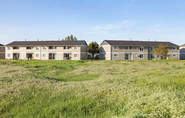 a row of apartment buildings in a field at Shiloh Glen, Billings