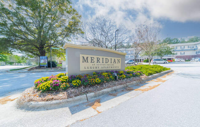 a sign that says meridian in front of a building