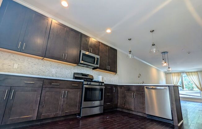 Spacious Upgraded Home in Graduate Hospital - 4BR/2.5BA with Hardwood Floors, W&D, Roof Deck, and Easy Street Parking