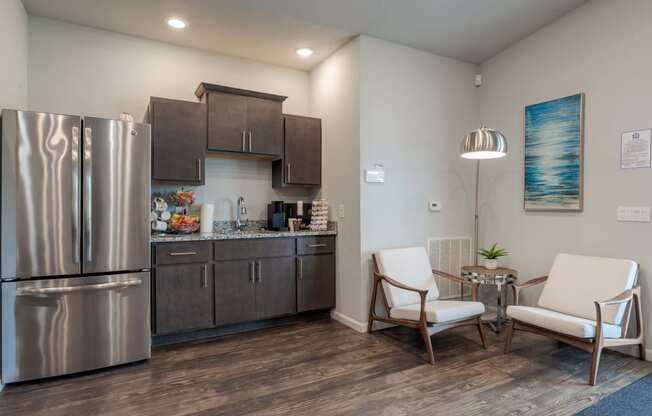 a kitchen with stainless steel appliances and a stainless steel refrigerator