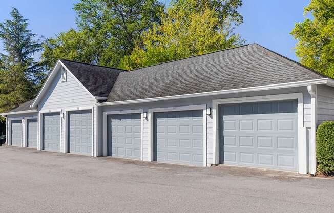 A two-car garage with a grey roof and white walls.