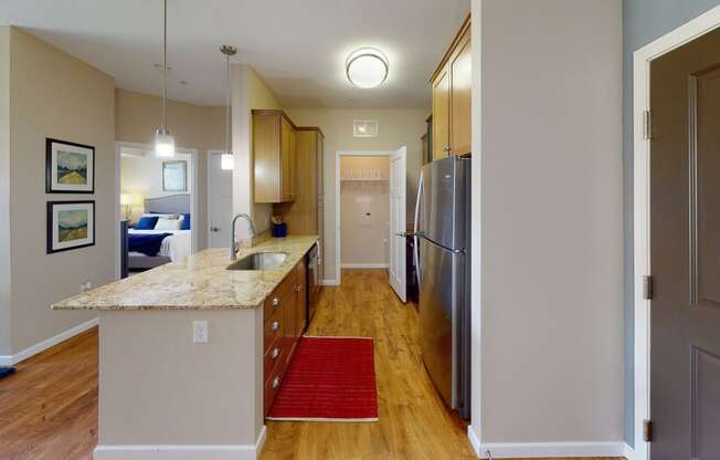 a kitchen with stainless steel appliances and a granite counter top