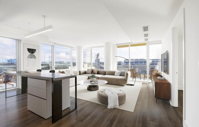 an open living room with white walls and hardwood flooring