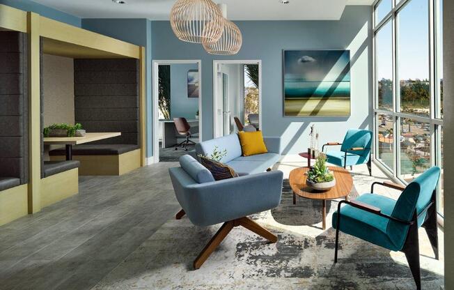 a living room with blue walls and a large window