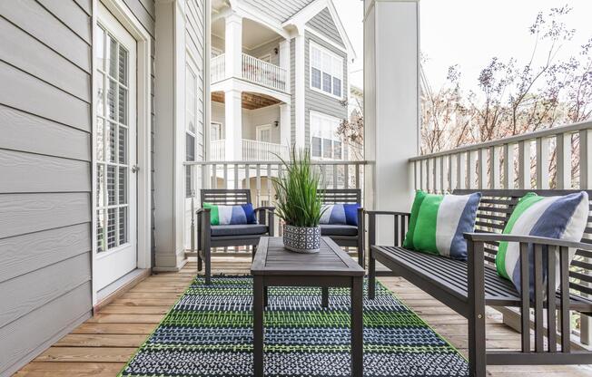 Private patio with railing and view of Durham, North Carolina apartment community