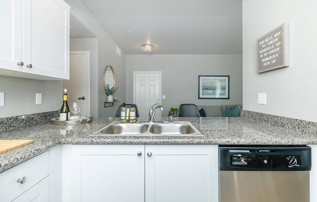 a kitchen with a stove a sink and a microwave