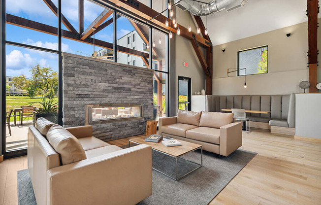 Community Clubhouse with Lounge Furniture and Fireplace at Elevate on Parkway Apartments, Burnsville