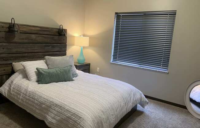 Furnished bed room with full size bed at north pointe villas in lincoln nebraska