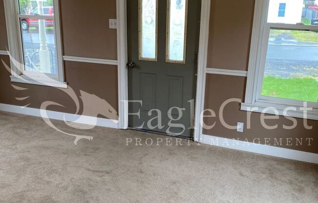 Charming 2 Bedroom Home With 1 Car Garage and A Covered Porch