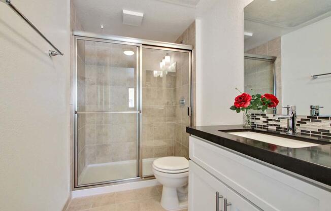 a bathroom with a toilet sink and shower  at Masselin Park West, Los Angeles, 90036