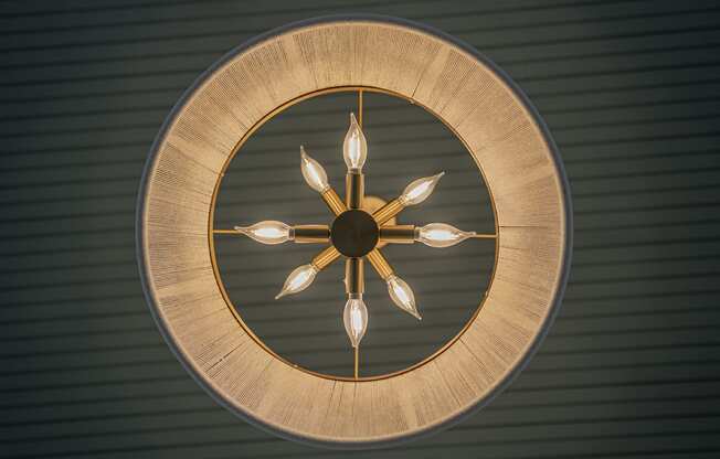 a circular wall clock with four spoons on it