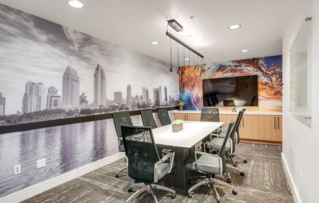 A conference room with a cityscape mural on the wall.