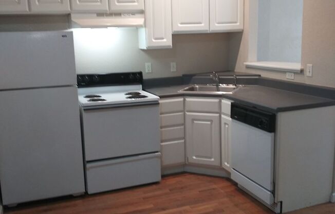 PRICED REDUCED!! Large windows and exposed brick wall