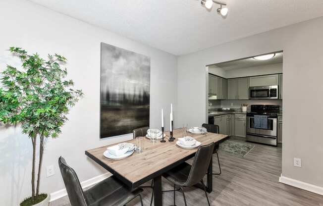 a dining room with a table and chairs