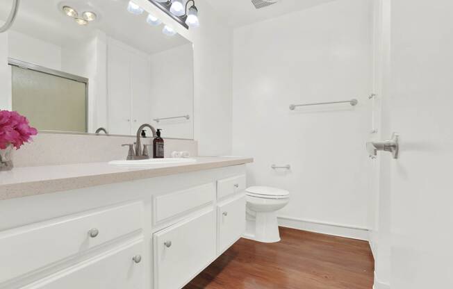 a bathroom with a sink and a toilet in it at Camino de Oro Apartments, Torrance, CA, 90505