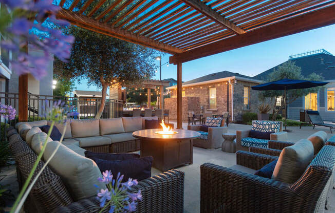 Outdoor seating area with fire pit table