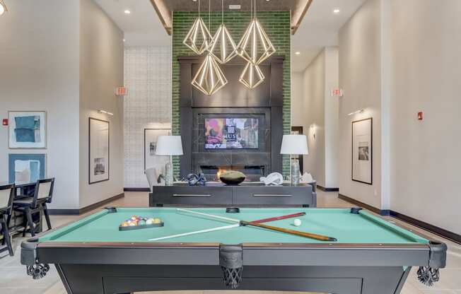 play a game of pool in our clubhouse at our apartments
