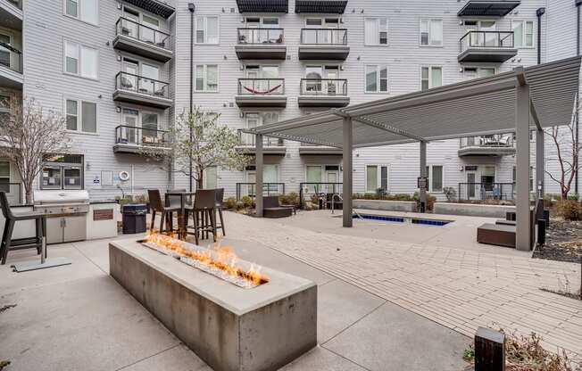 River North Apartments for Rent - Waterford RiNo Apartments - Courtyard Area with Fire Pit and Grill Station