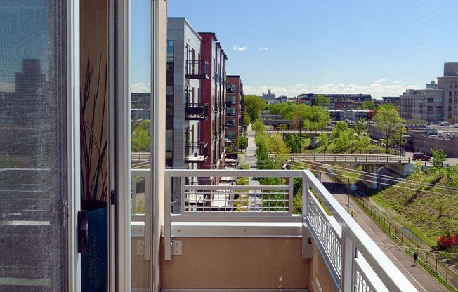 a balcony with a view of the city