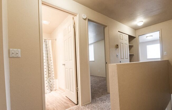 Lakewood Apartments - Southern Pines Apartments - Second Floor Landing, Bathroom, Hall Closet, and Bedrooms