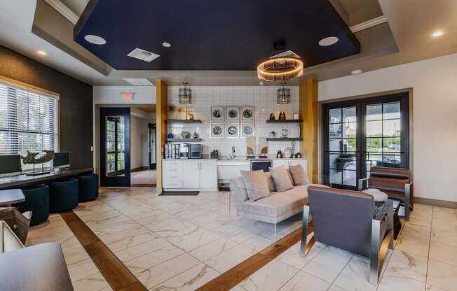 A modern living room with a kitchen area in the background.