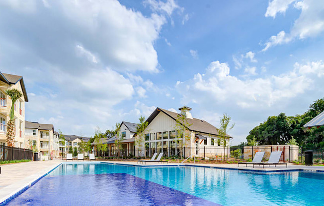 a large swimming pool in front of a group of houses at Legacy at Cibolo, Boerne