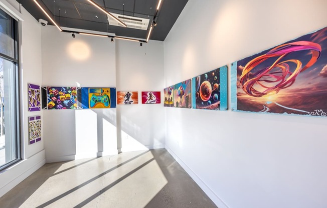 A wall of posters with different designs on them.