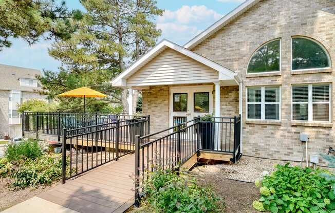 Exterior of the Skyline View clubhouse and leasing office with wraparound porch