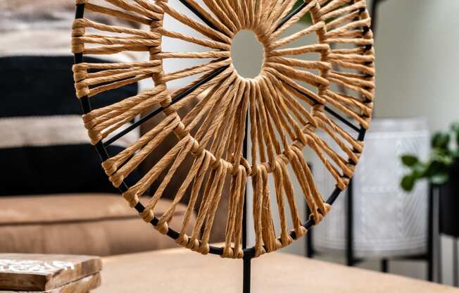 a decorative brass fan sculpture on a table
